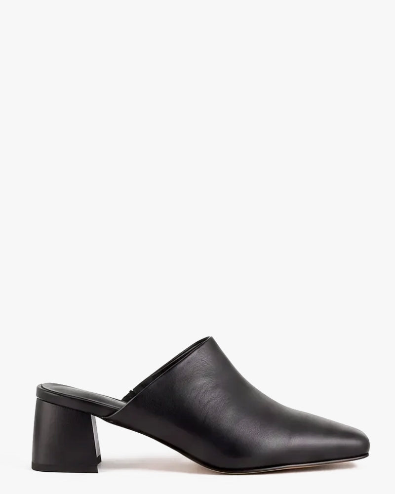 A single black leather mule shoe with a pointed toe and a chunky block heel, shown in profile against a plain white background.