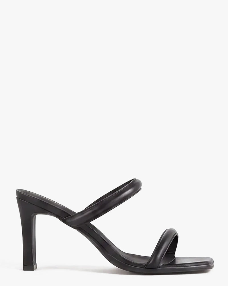 A single black leather high-heeled sandal with a square toe, shown in a side profile against a plain white background.