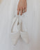 Rudi Ellis holding Wedding shoe 