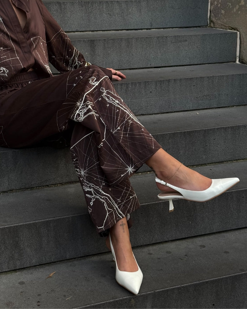 Alexandra slingback in white on model 